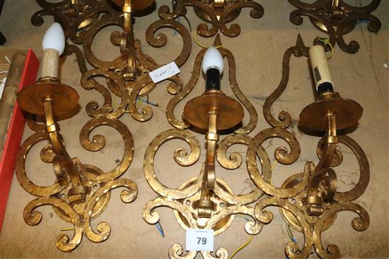 A set of 7 gilt wrought iron wall lights(-)